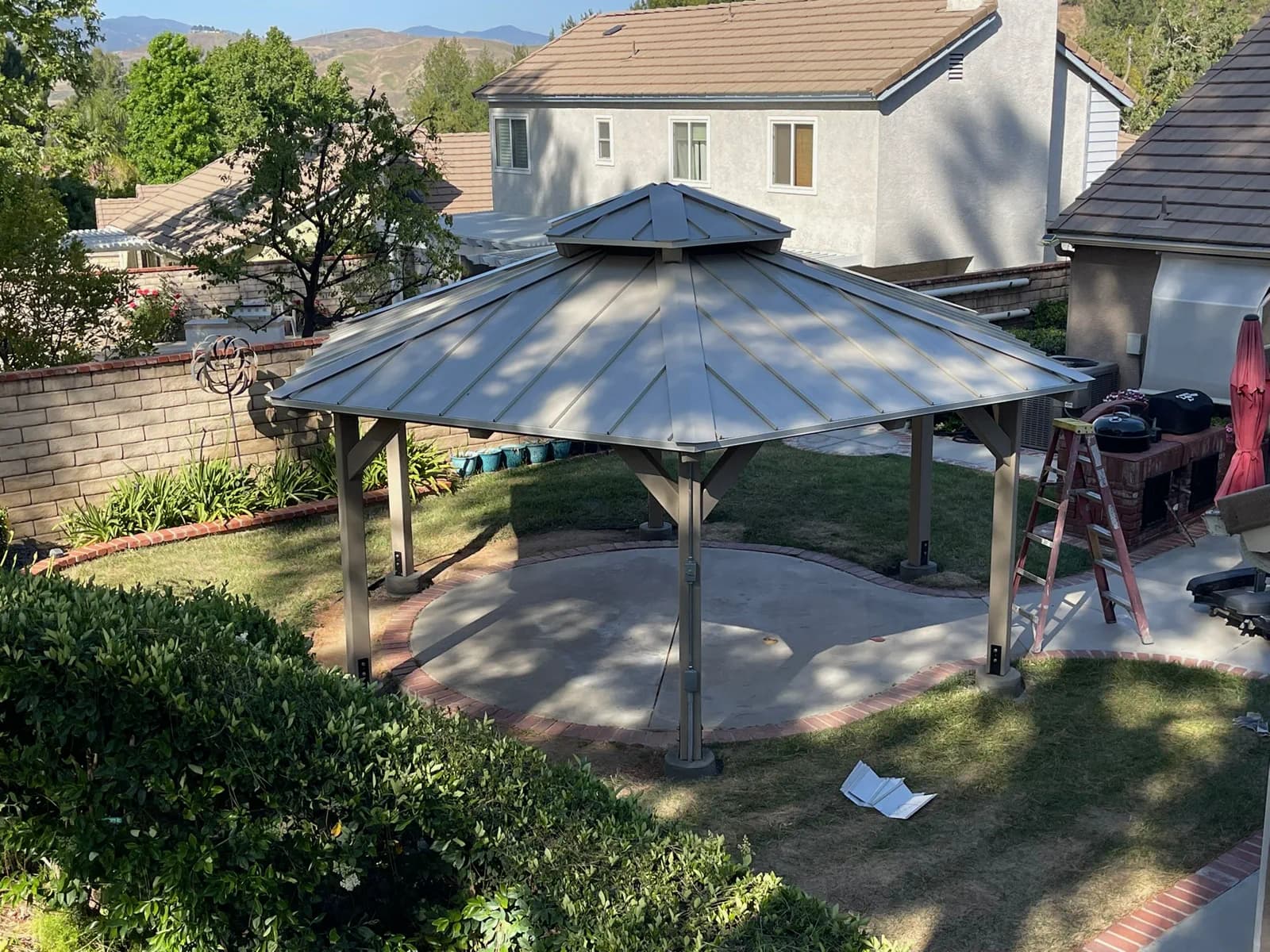 Aerial view of a finished hip roof gazebo in a Santa Clarita backyard.